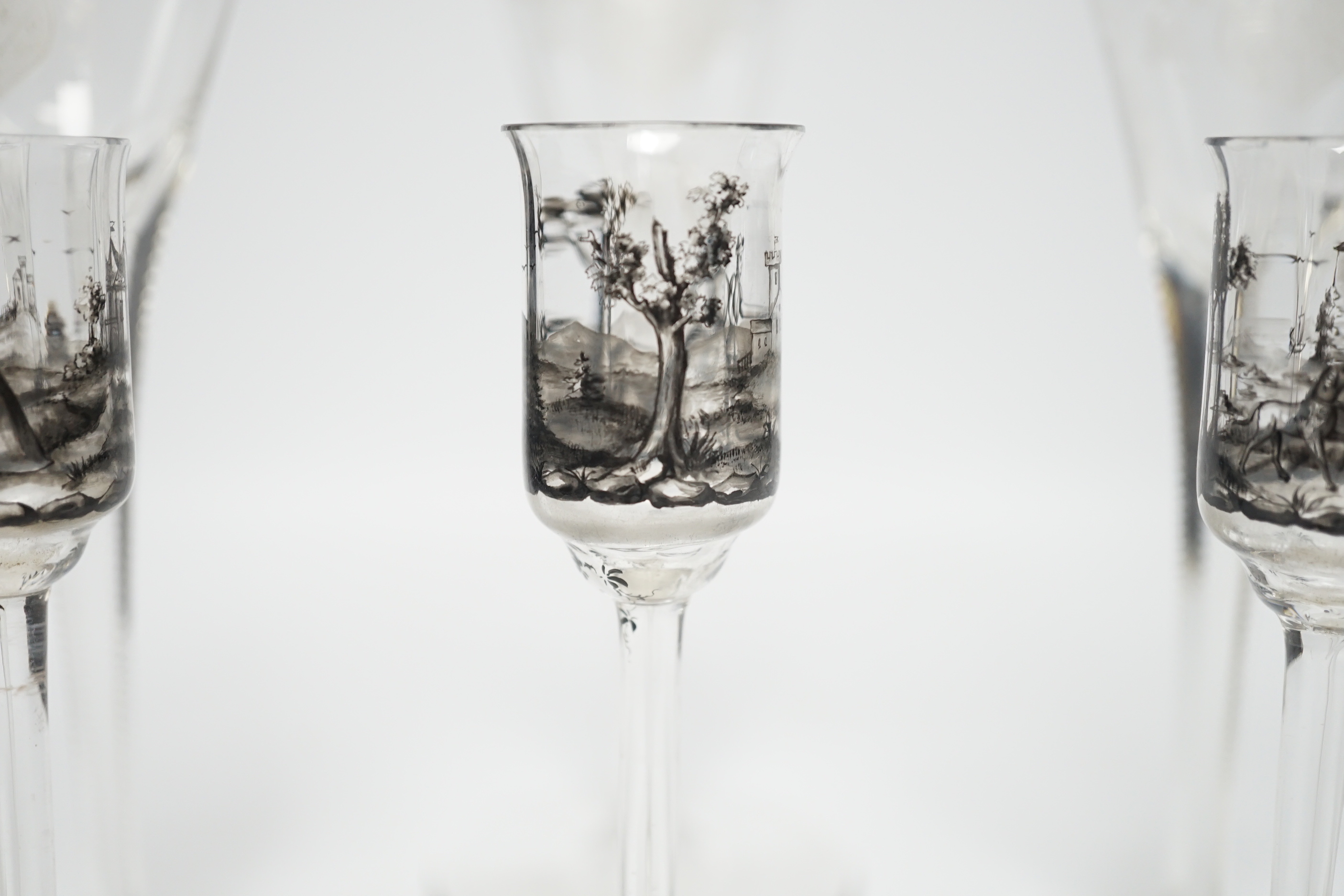 Set of three armorial crest etched flutes and three enamelled liqueur glasses, largest, 23cm high